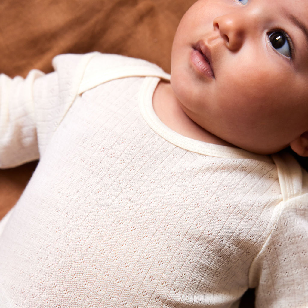Nature Baby Merino Wool Long Sleeve Bodysuit Pointelle in Natural